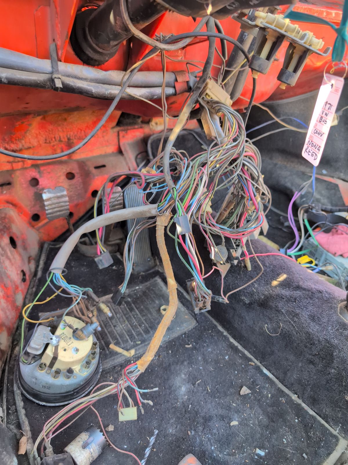 Wiring harness repair under the dash of an older vehicle
